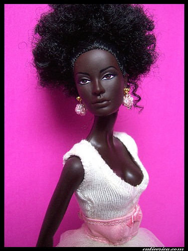 AT LAST A BARBIE THAT IS A BLACK SKINNED BEAUTY WITH SORT OF WOOLY HAIR!